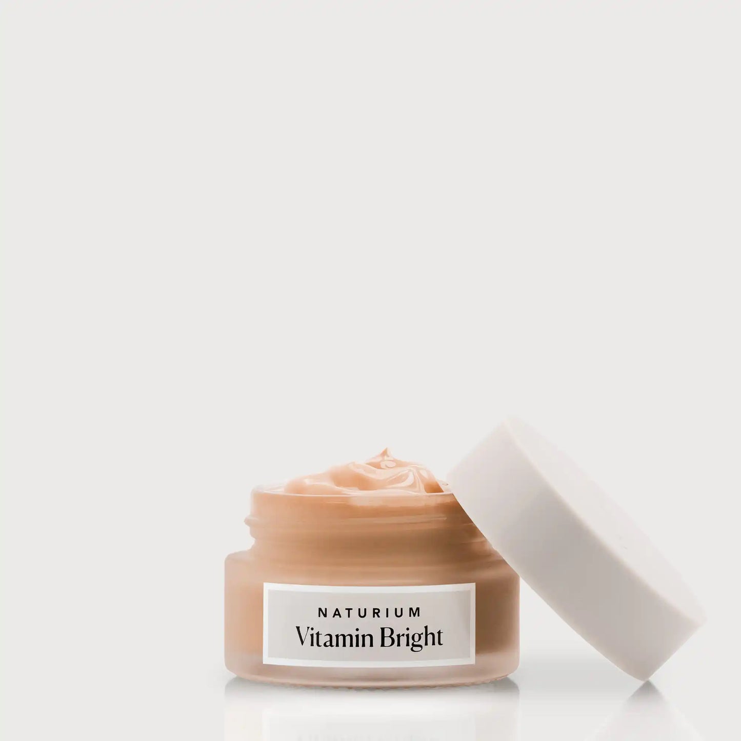 vitamin-bright-illuminating-eye-cream-t0 NATR-VitaminBright_DEEP_Primary_front_openjar_bone.webp