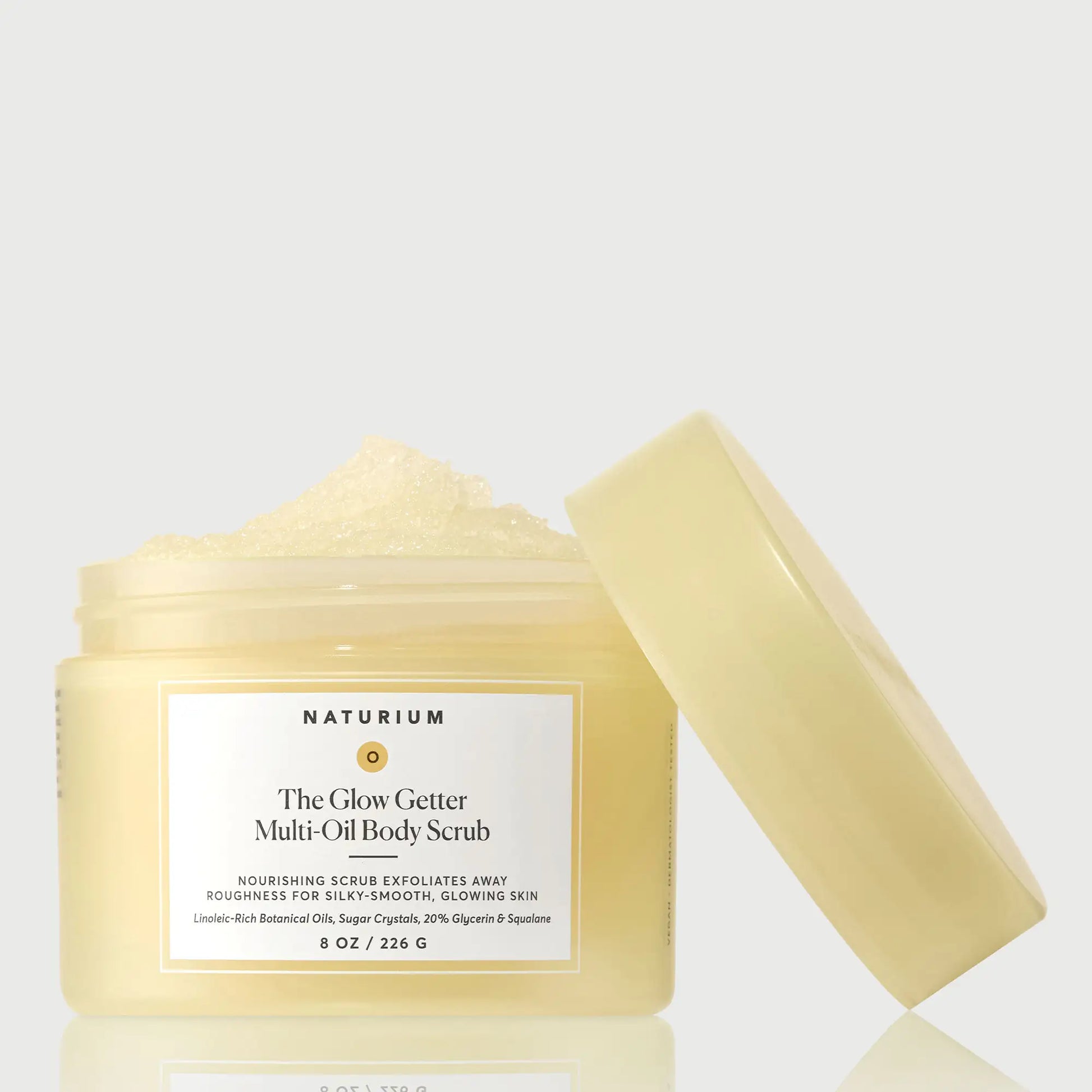 the-glow-getter-multi-oil-body-scrub-z9 NATR-40028-GlowGetter-Multi-Oil-Body-Scrub-Front-CapOff-bonebkgd.webp